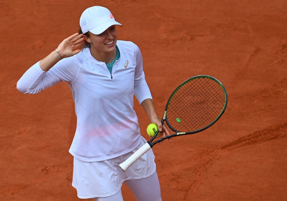 Poland's Iga Swiatek celebrates after winning against Argentina's Nadia Podoroska during their women's singles semi-final tennis match on Day 12 of The Roland Garros 2020 French Open tennis tournament in Paris on October 8, 2020. (Photo by Anne-Christine POUJOULAT / AFP) (Photo by ANNE-CHRISTINE POUJOULAT/AFP via Getty Images)